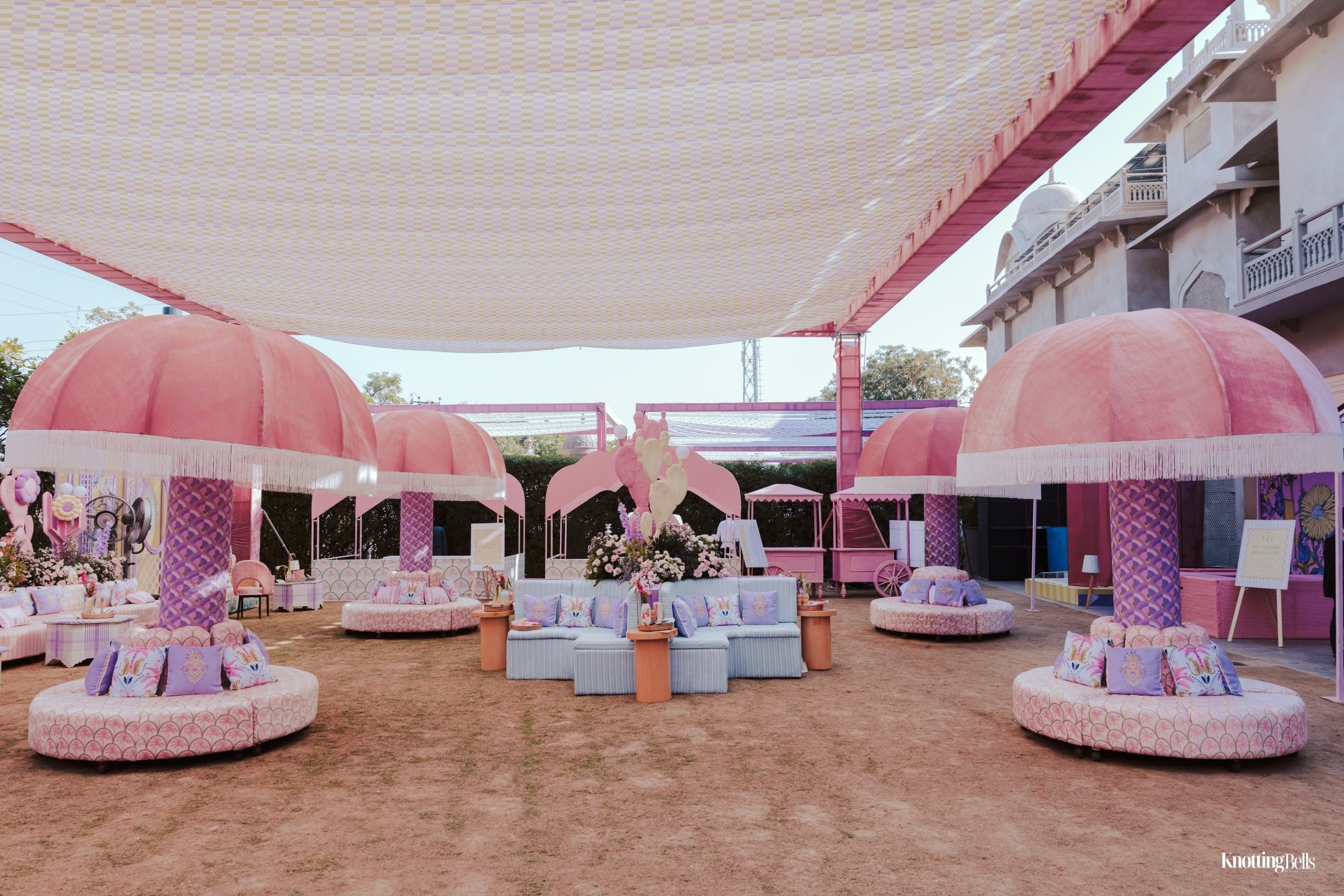 Lala Love Land — pink mushroom umbrella seating under a canopy